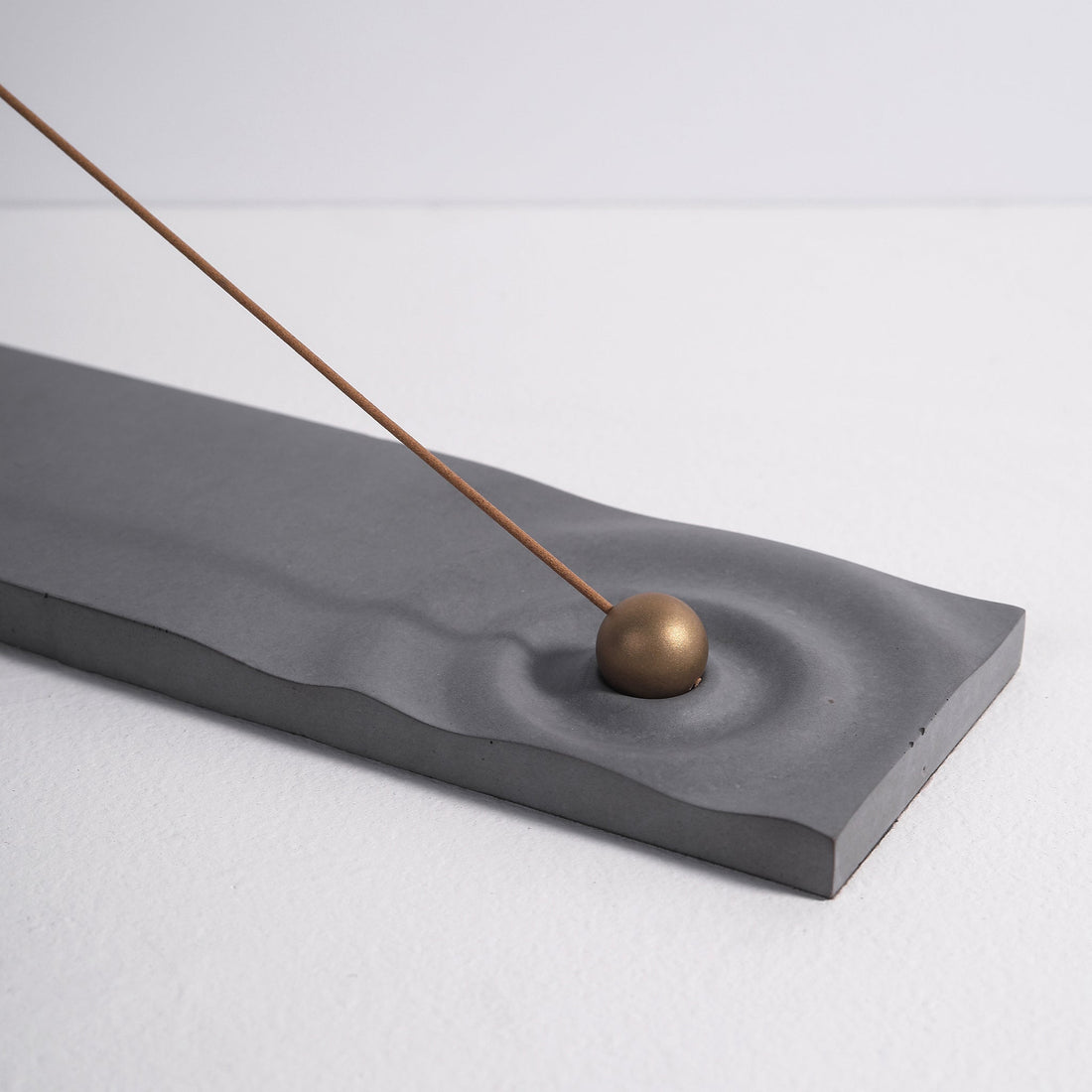 Ripple incense burner in gray by Kin Objects for incense sticks side view