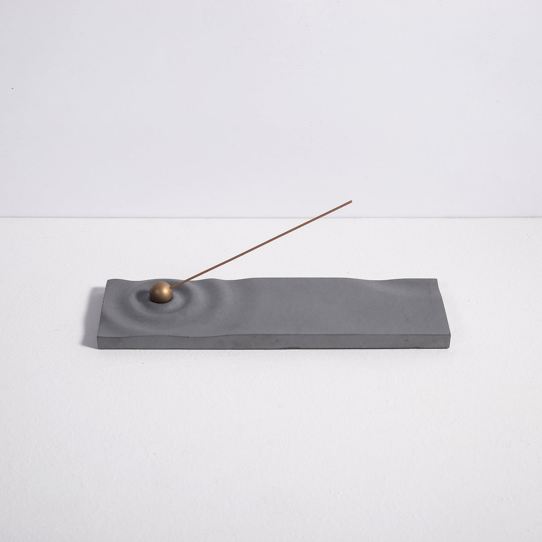 Ripple incense burner in gray by Kin Objects for incense sticks side view